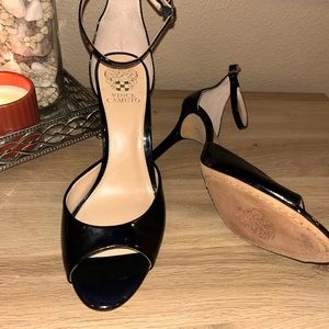 Vince Camuto black opened toed heels with ankle strap.